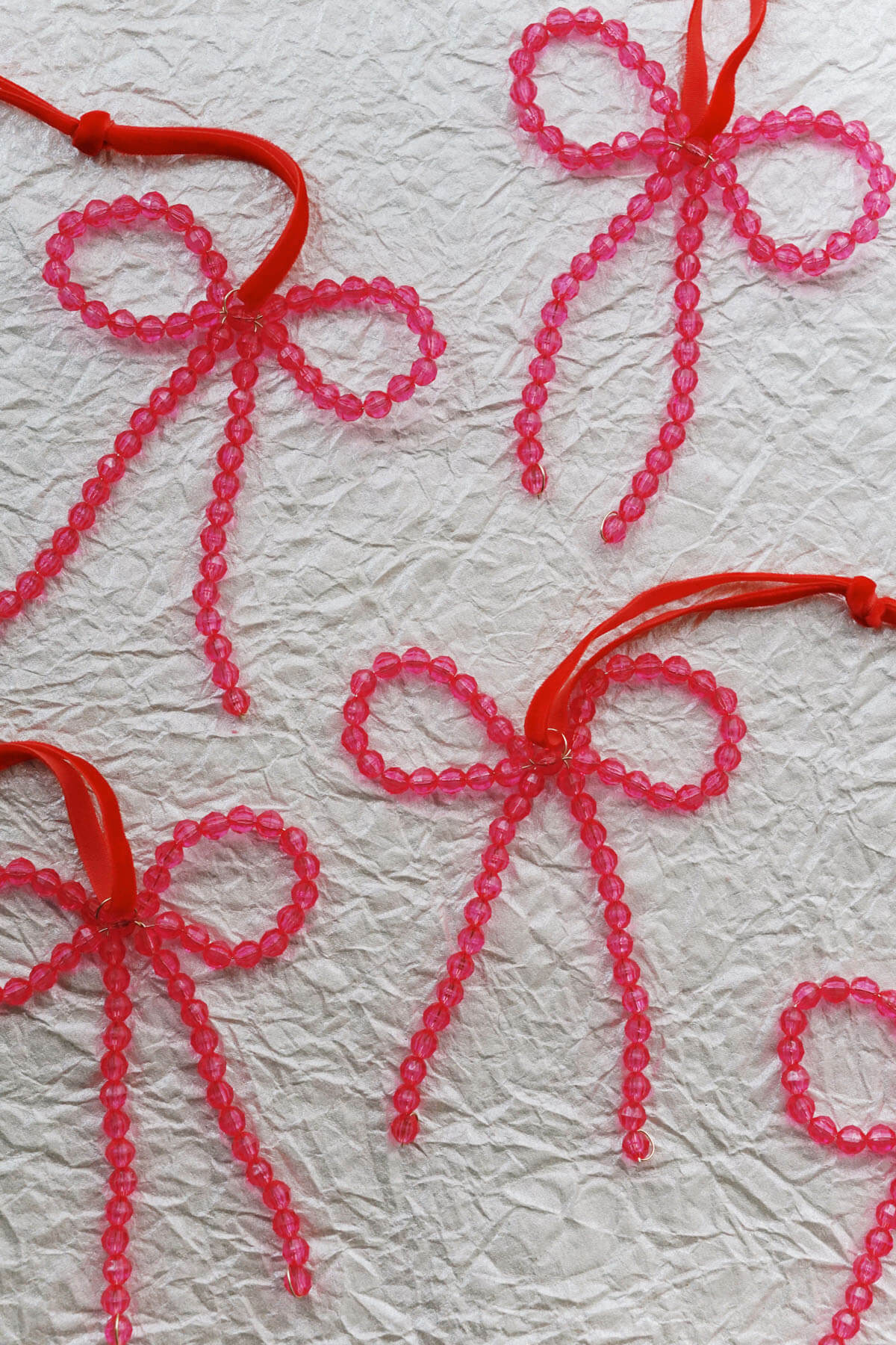Set of pink Christmas ornaments with red velvet ribbon - wallflower