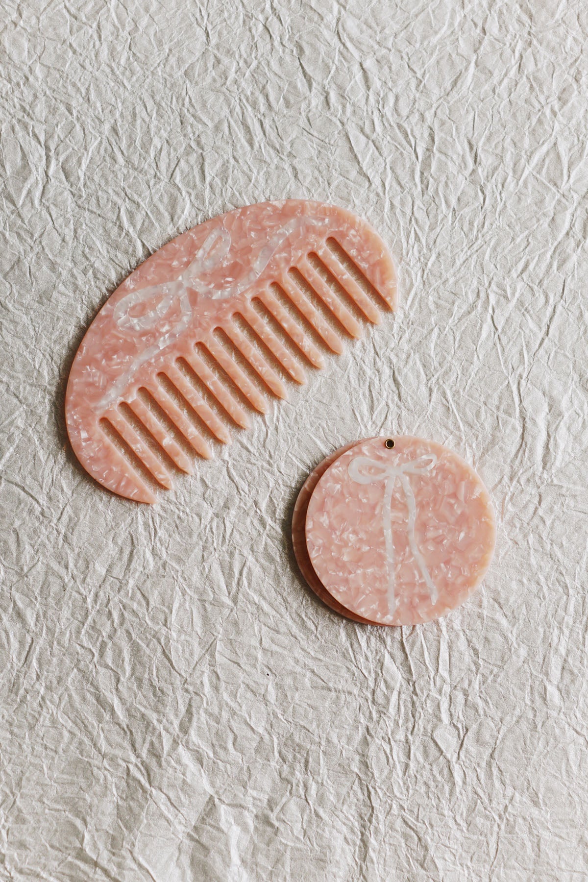 pink gua sha hair comb with bow in cellulose acetate ✿ shop small gift ideas on wallflower