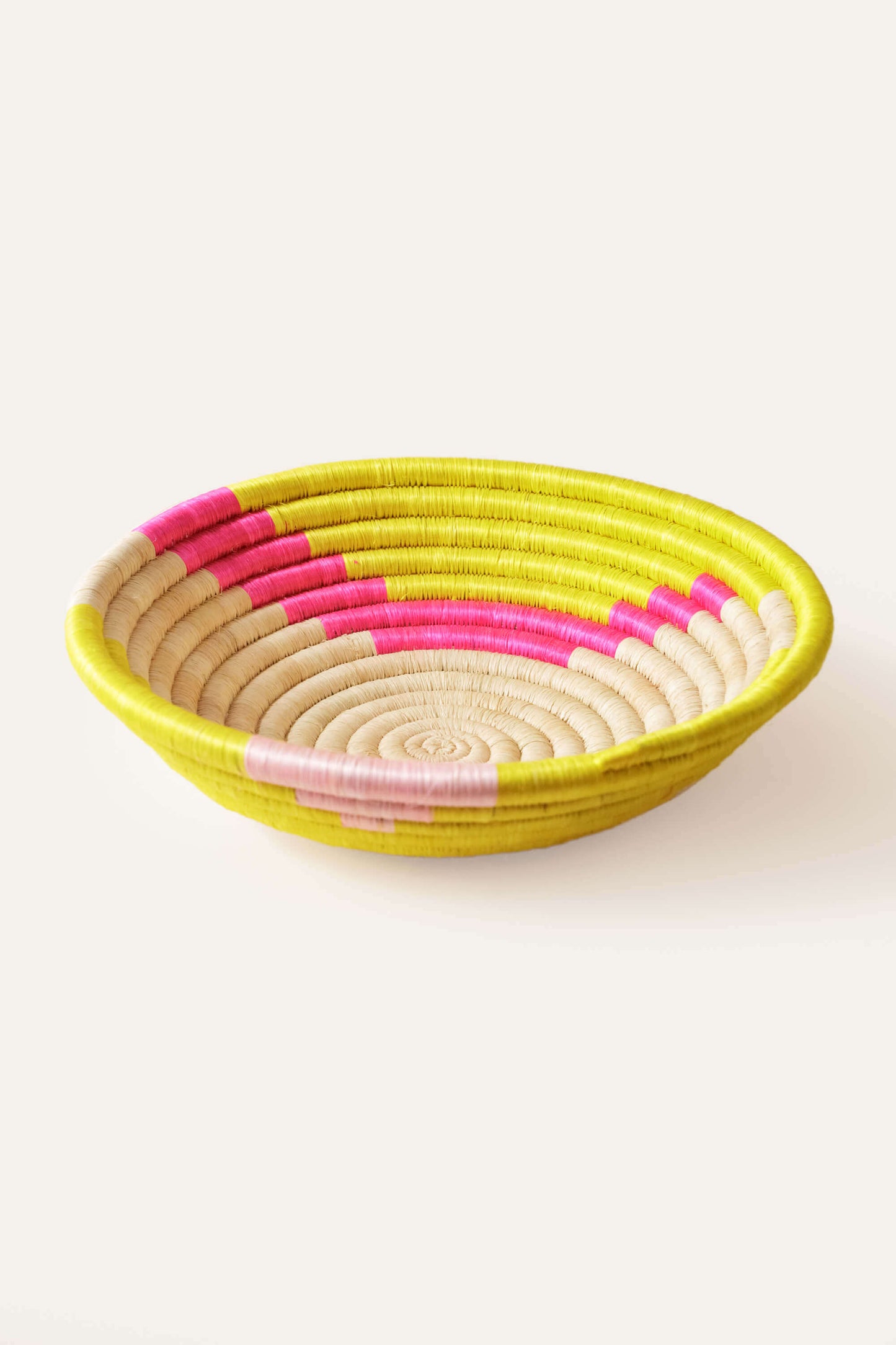 pink + yellow woven wall basket fair trade