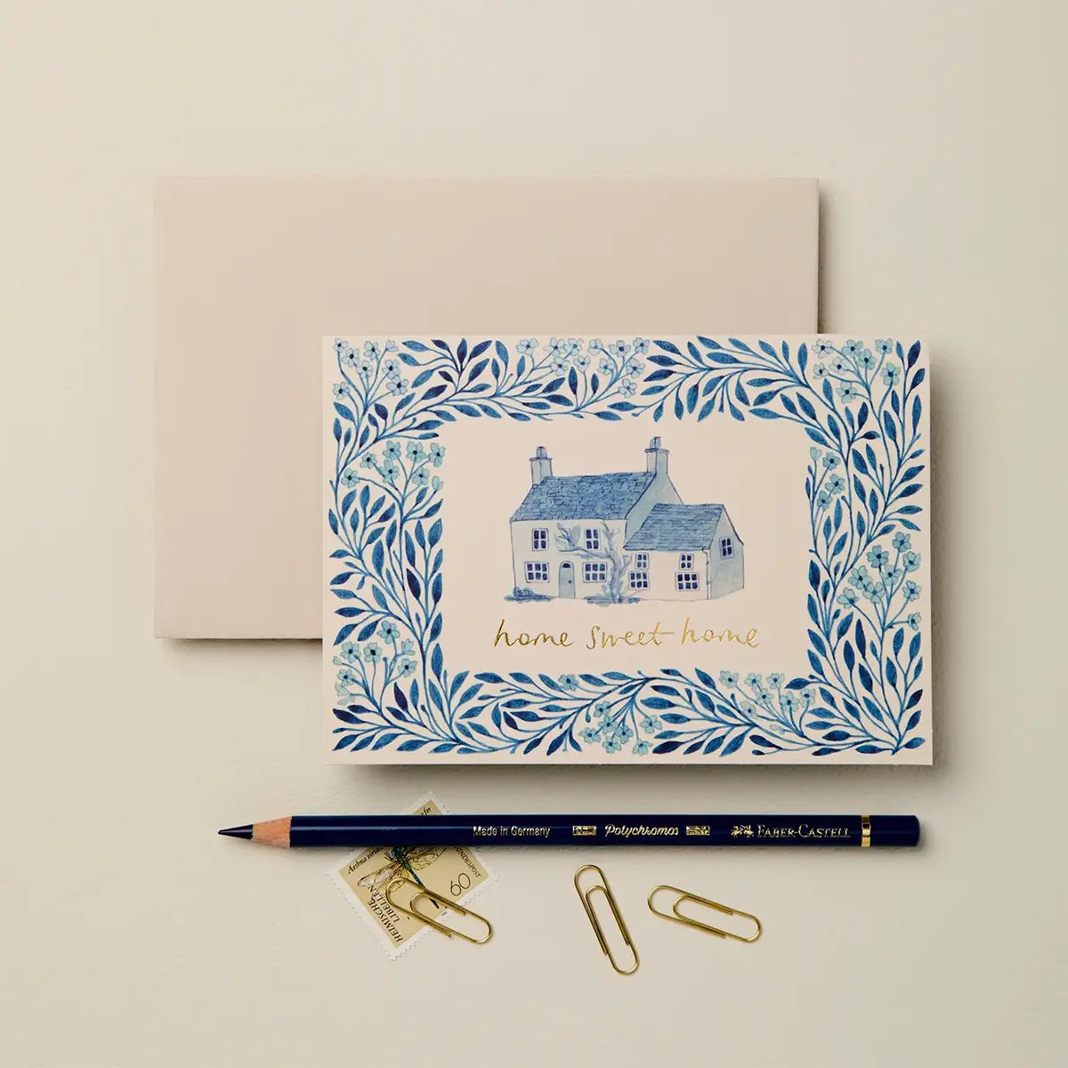 blue floral house illustration with "home sweet home" for new home card