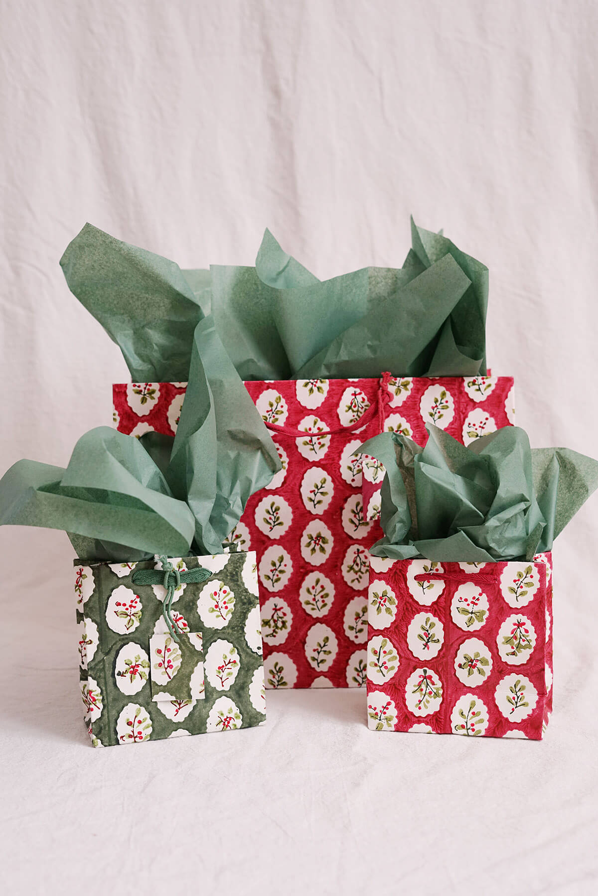 collection of recycled christmas gift bags on handmade paper - shop holiday on wallflower