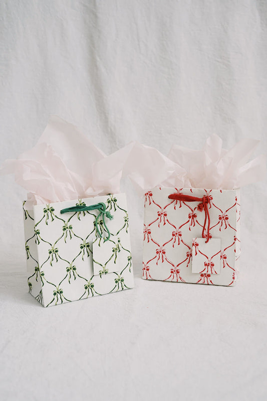 small eco friendly christmas gift bags with bows in green and red - hand block printed recycled gift bags