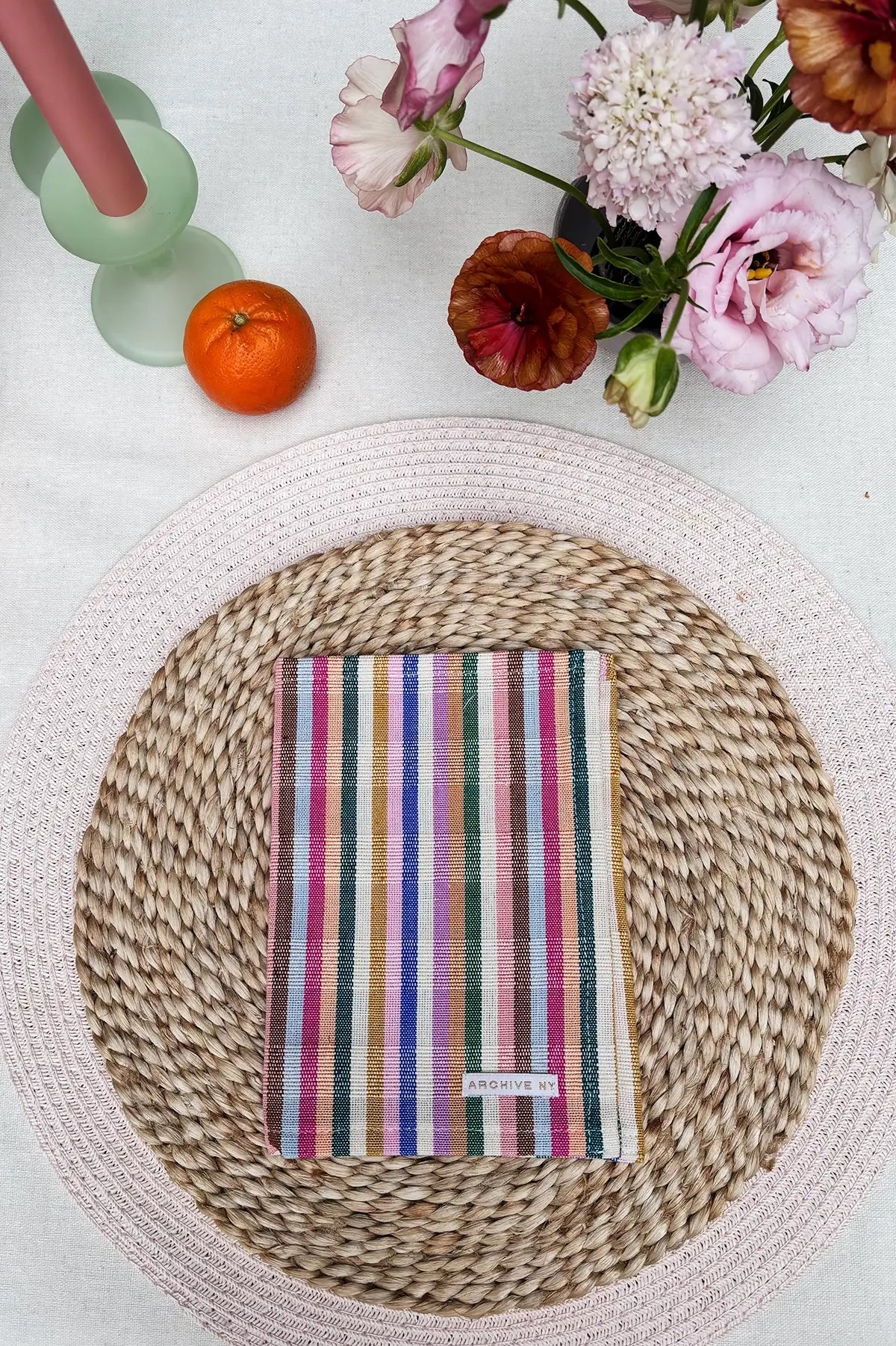place setting with rainbow cocktail napkin