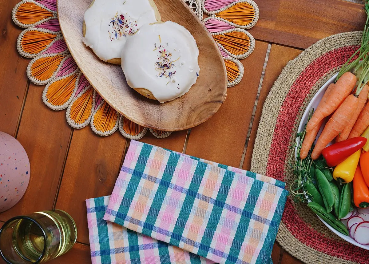 Outdoor table with snacks and cookies on colorful placemats with Archive New York napkins - shop summer entertaining on wallflower