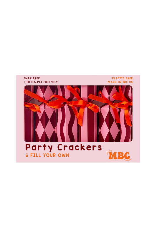 Box of party Christmas crackers with red ribbons 