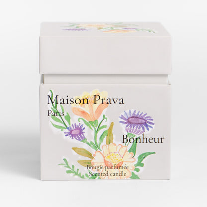 Maison Prava Bonheur luxury candle packaging with floral design on a white background