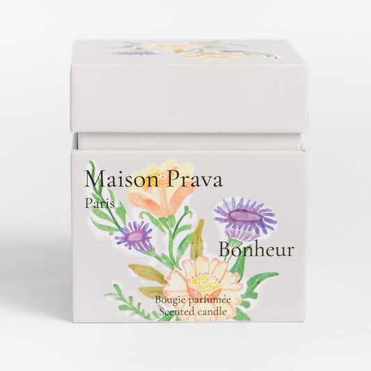 Maison Prava Bonheur luxury candle packaging with floral design on a white background