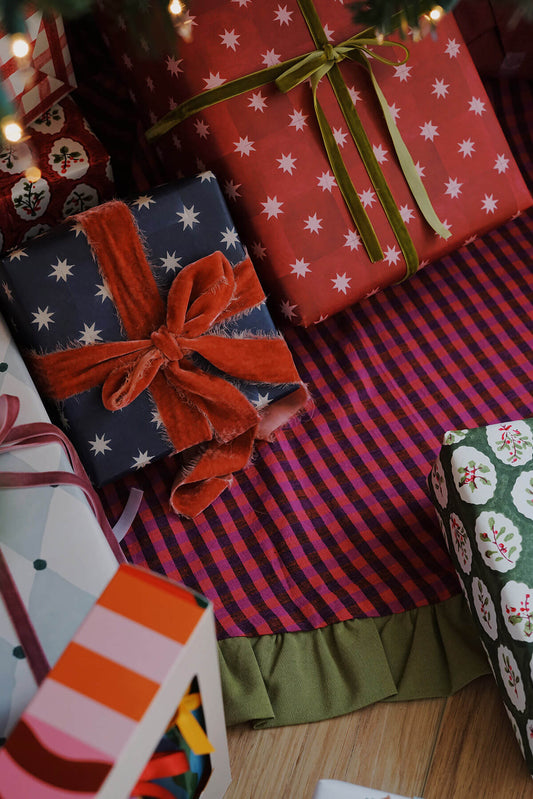 whimsical christmas gift wrap under tree red and blue star pattern wrapping paper - shop colorful maximalist holiday on wallflower