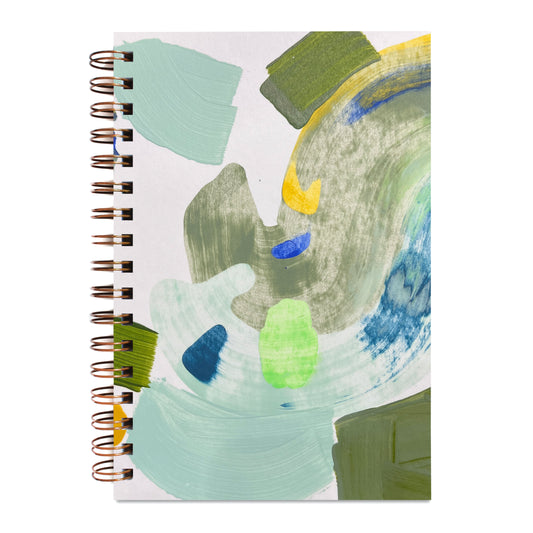 Blank notebook with abstract art cover featuring green, blue, and yellow colors on a white background.