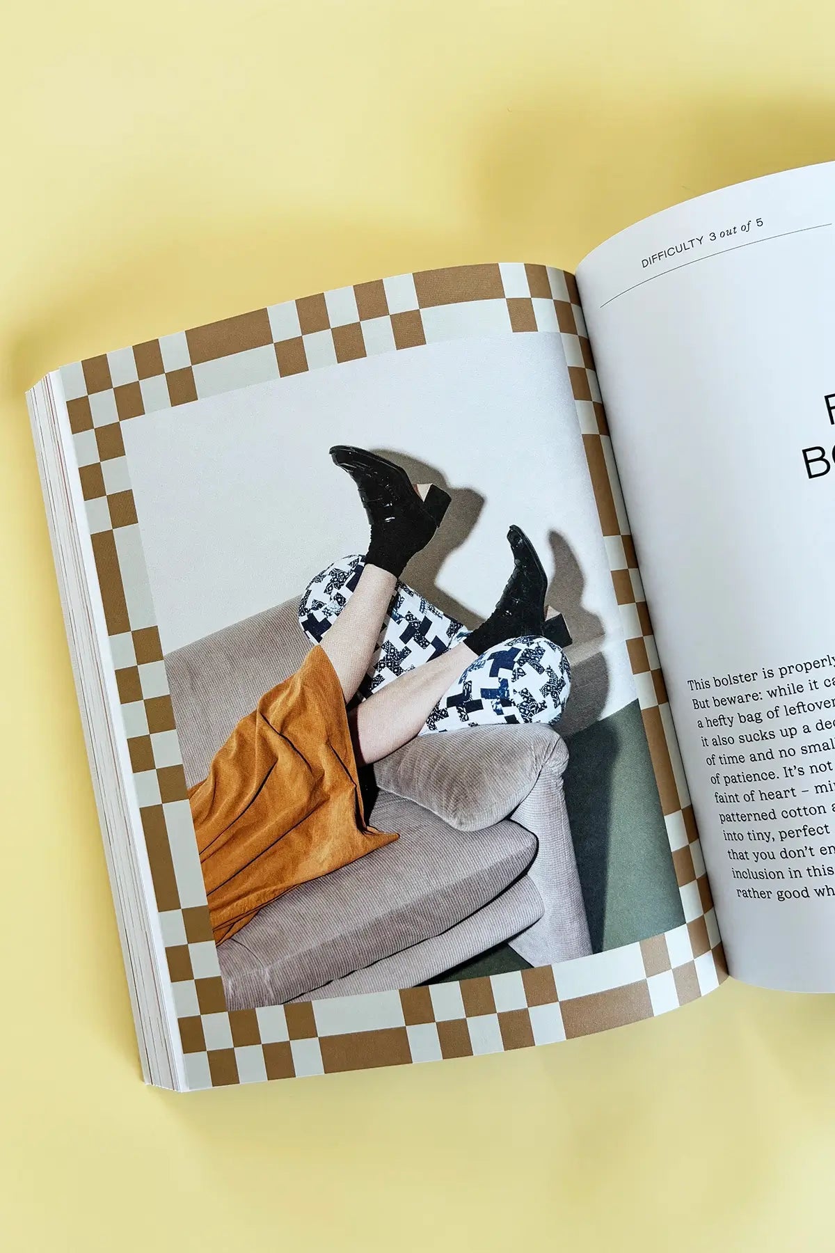 inside of modern quilting book - photo of legs on couch with cushions