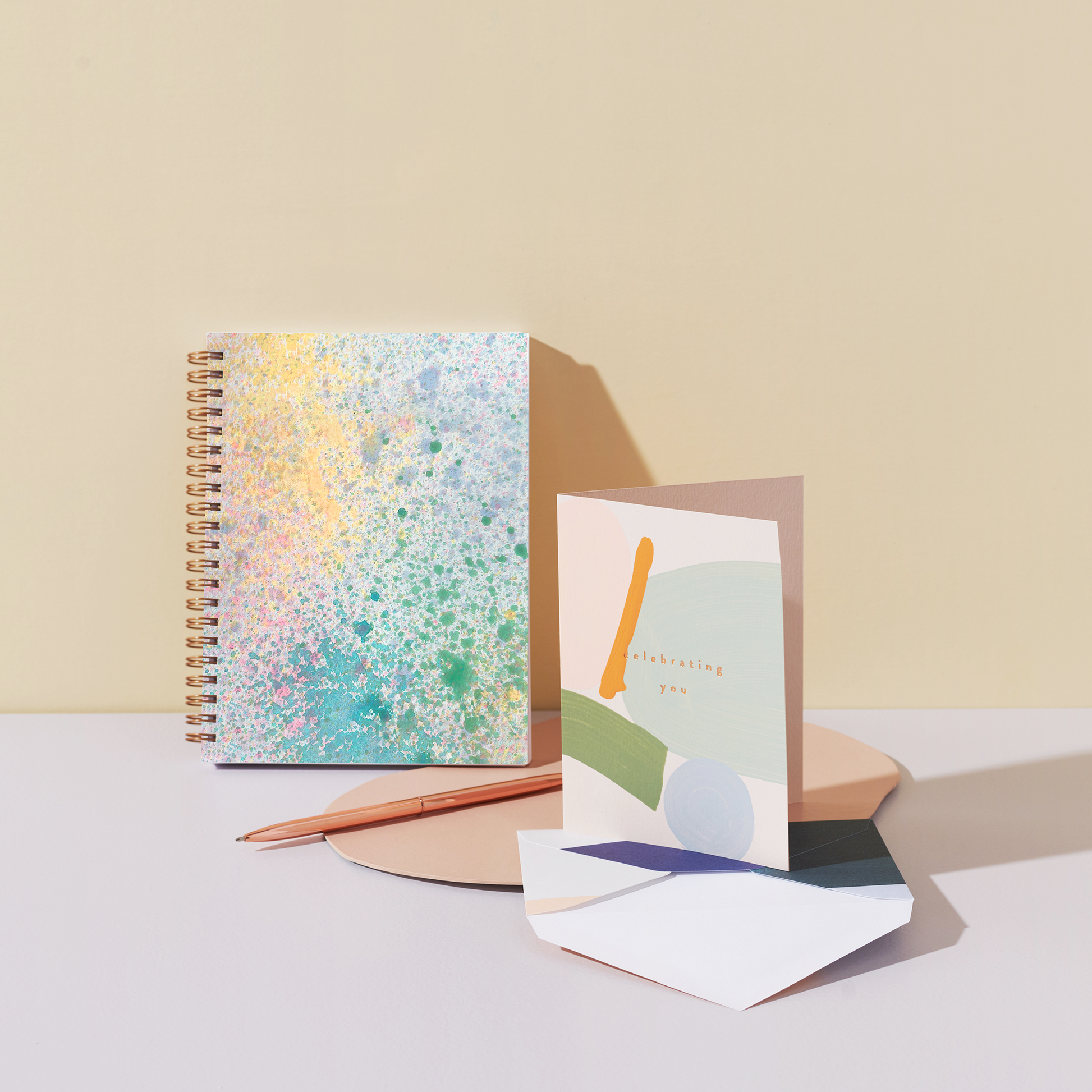 dreamy pastel blank notebook with splatter design, pink, blue, and green