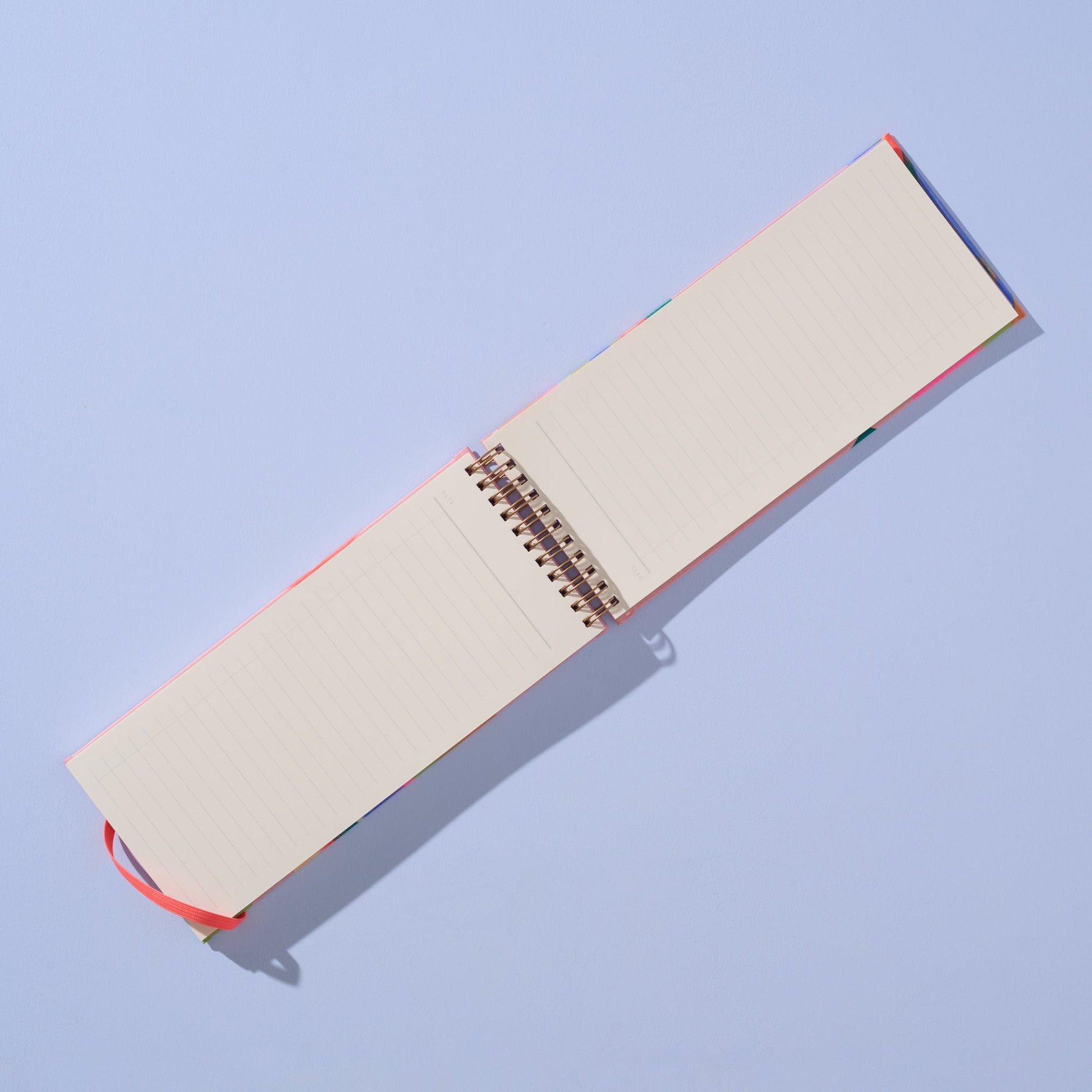 Open notebook with beige pages on a light blue background