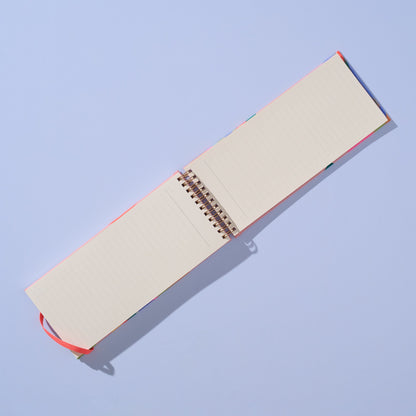 Open notebook with beige pages on a light blue background