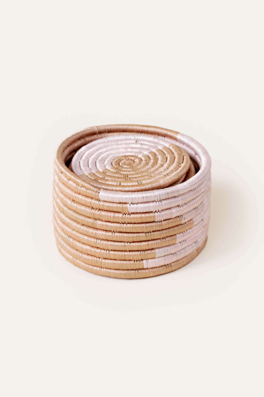 Stack of woven baskets in pink and brown from wallflower - handmade housewarming gifts