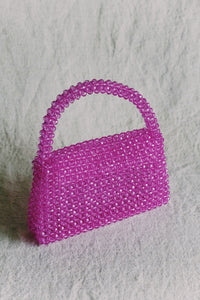 bead bag in fuchsia by melie bianco for wallflower shop