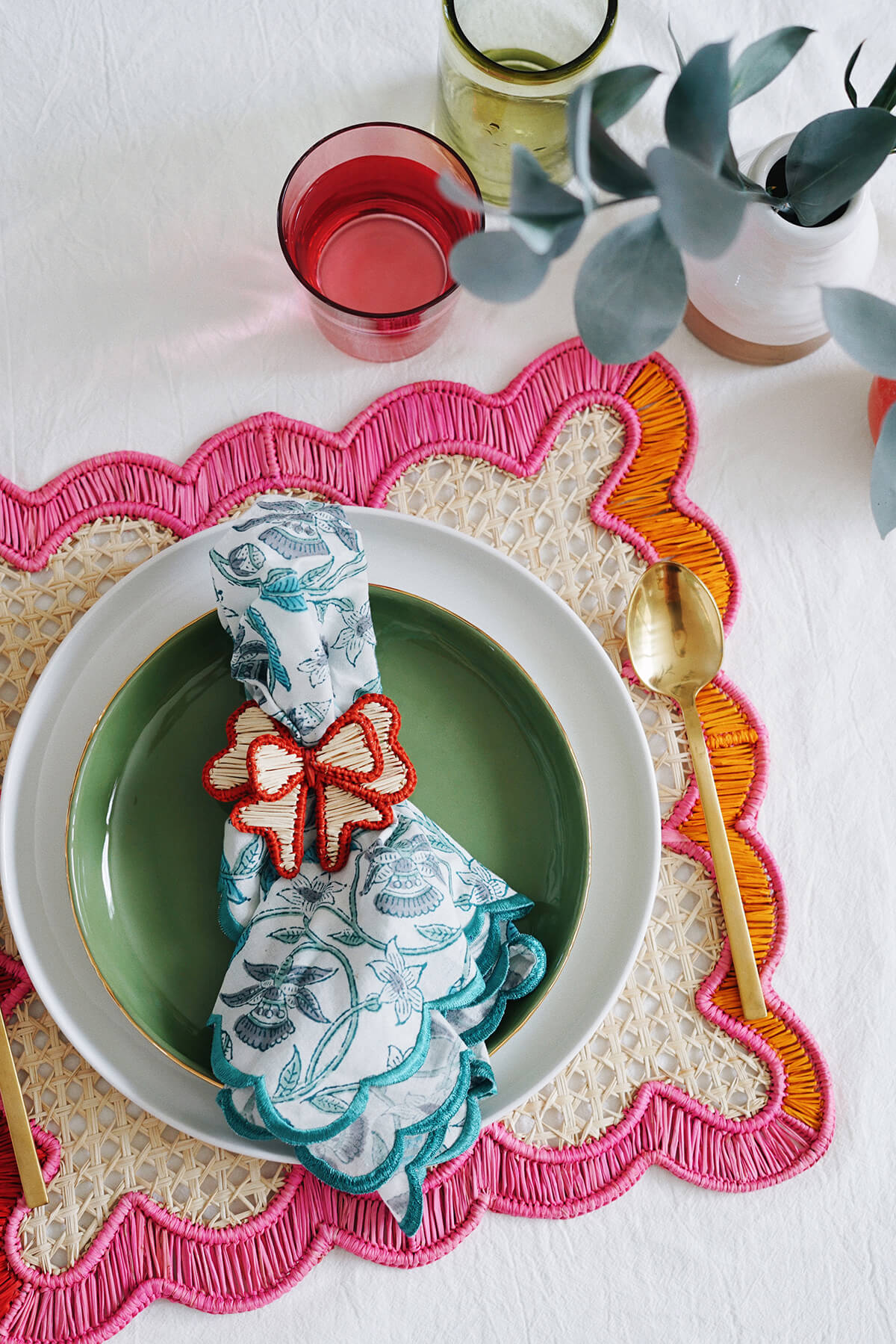 colorful wavy square woven placemats + red bow napkin ring from wallflower shop decor