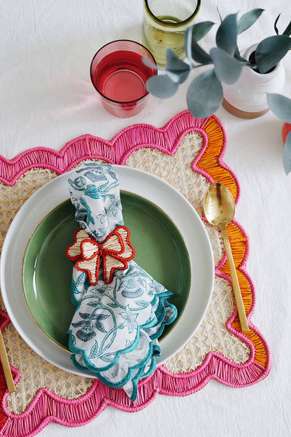 colorful wavy square woven placemats + red bow napkin ring from wallflower shop decor