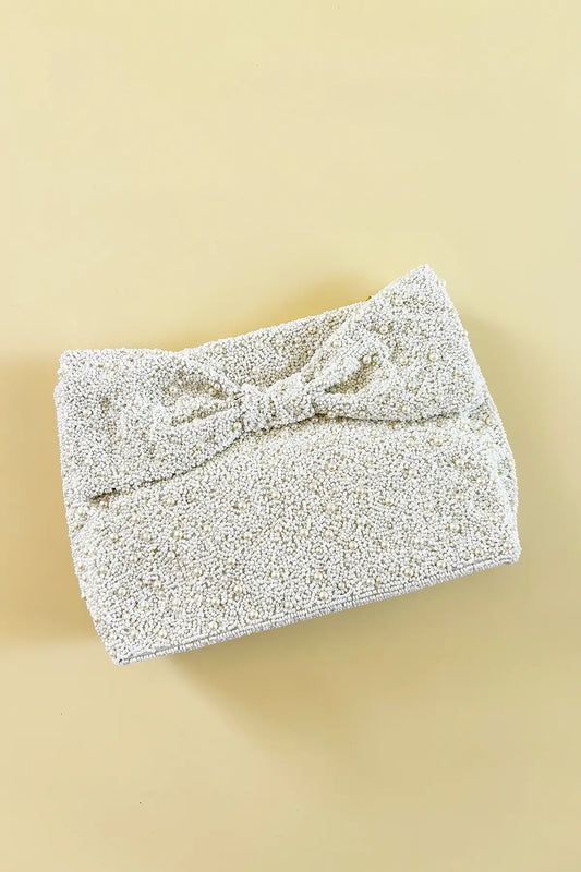 white bridal bow clutch purse with pearl beadwork
