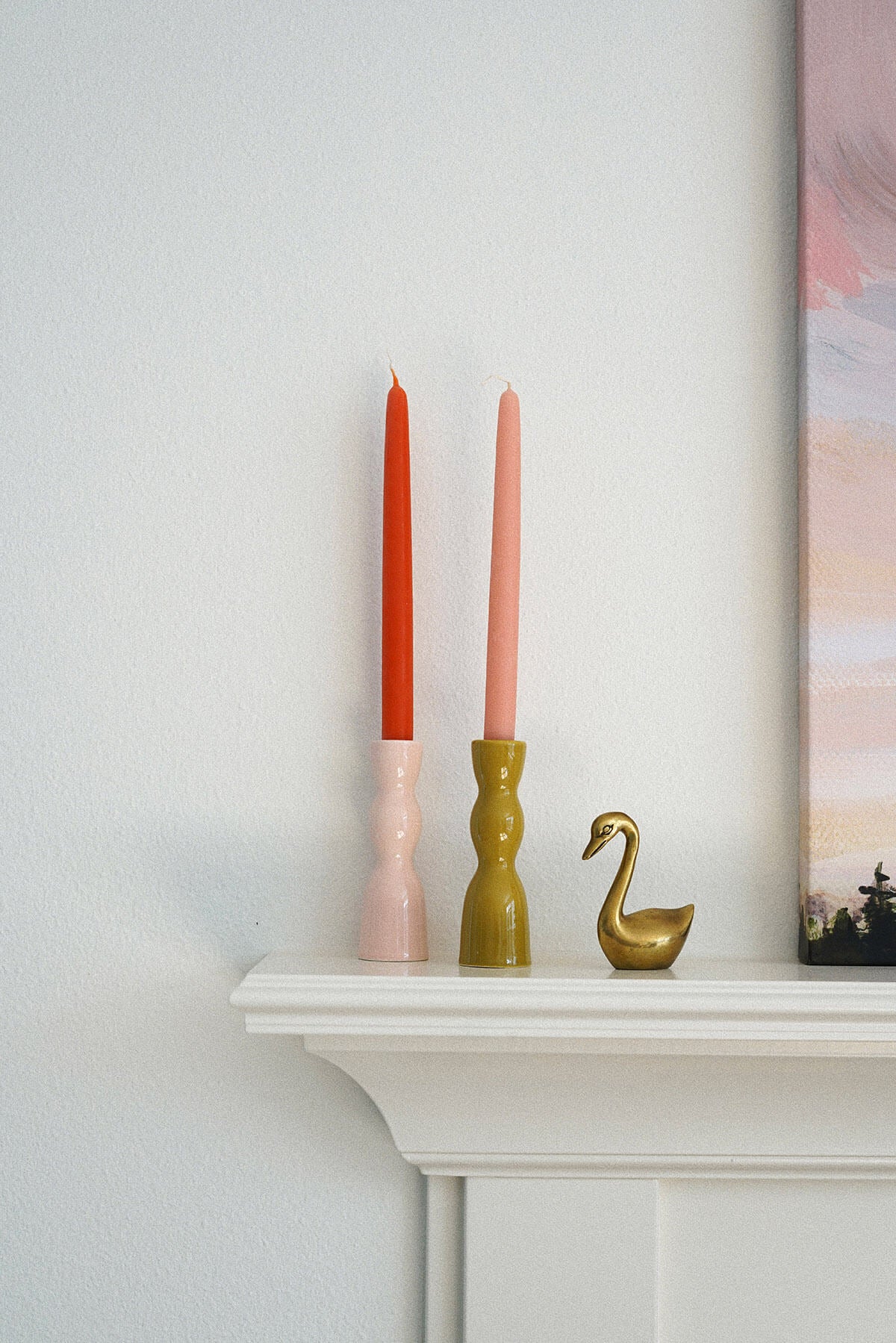 pink & olive green taper candle holders ceramic on mantel