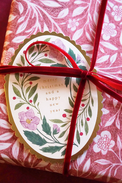 Oval floral merry christmas card - merry christmas & happy new year with pink wrapping paper + red ribbon- wallflower