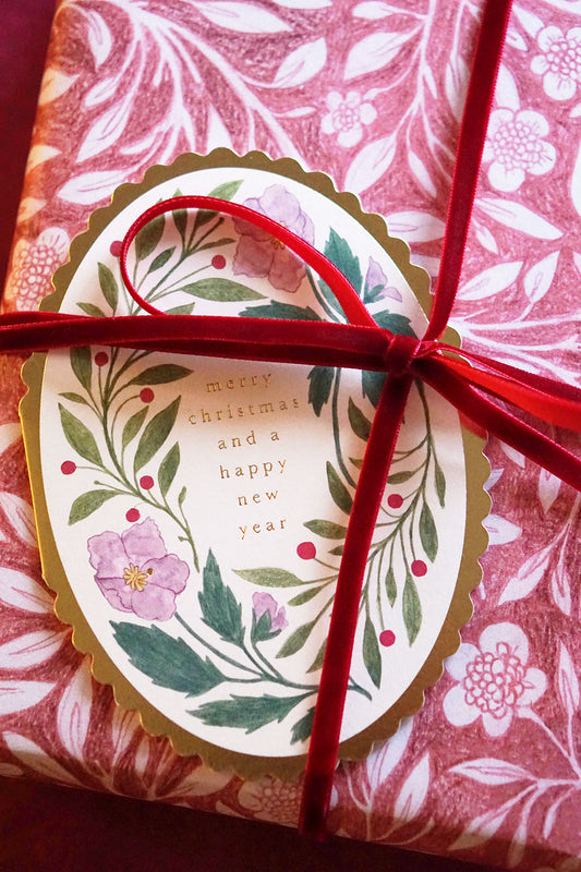 Oval floral merry christmas card - merry christmas & happy new year with pink wrapping paper + red ribbon- wallflower