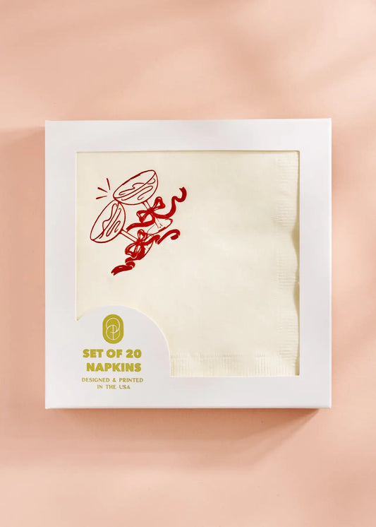 cute paper cocktail napkins with red bow and glasses clinking for holiday parties