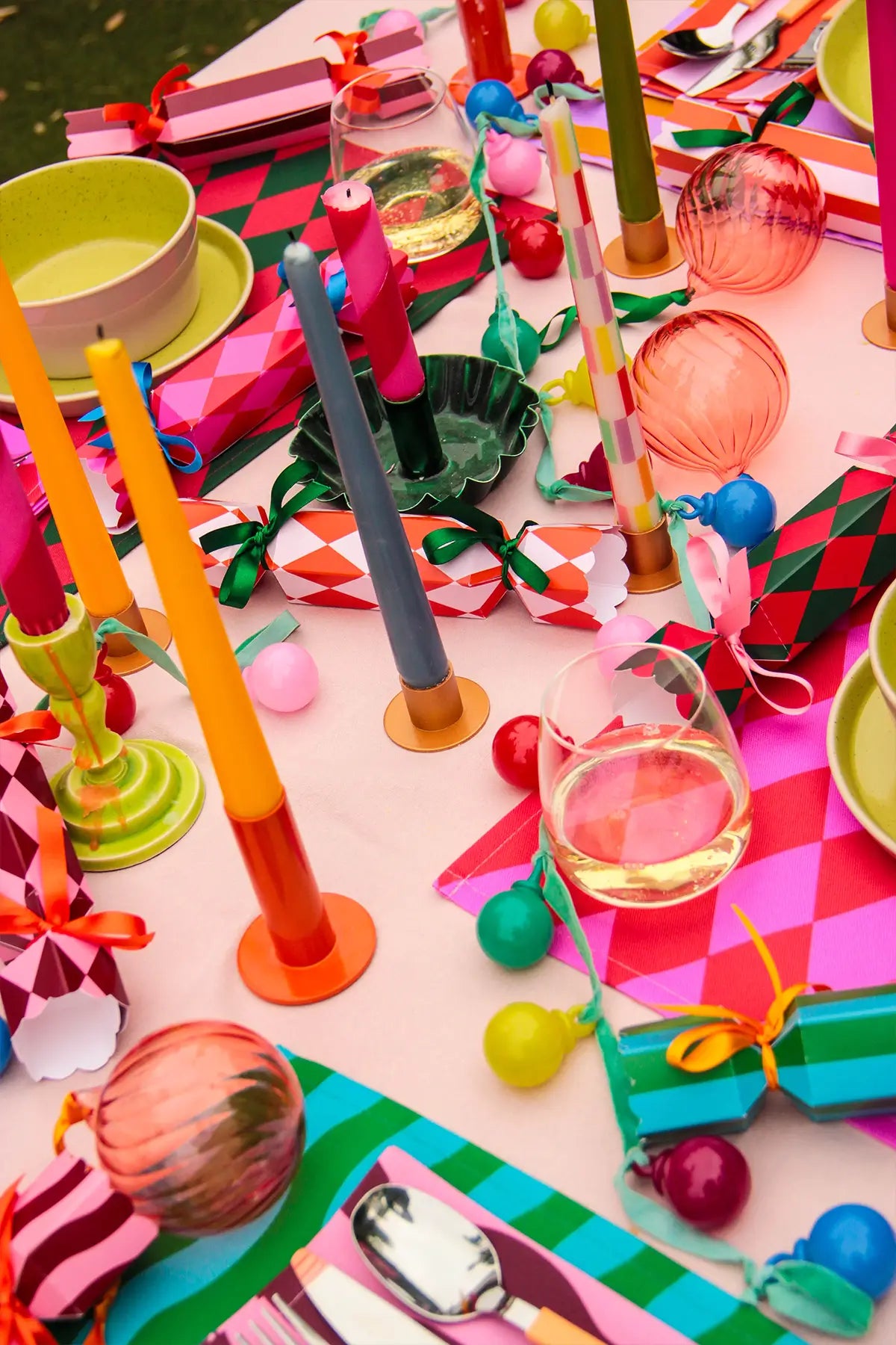 Colorful Christmas table setting with christmas crackers