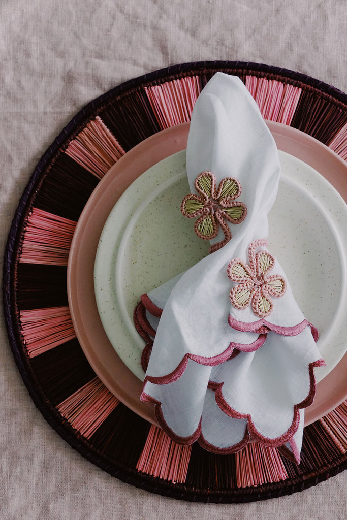 colorblock pink placemat with pink flower napkin rings - pink place setting