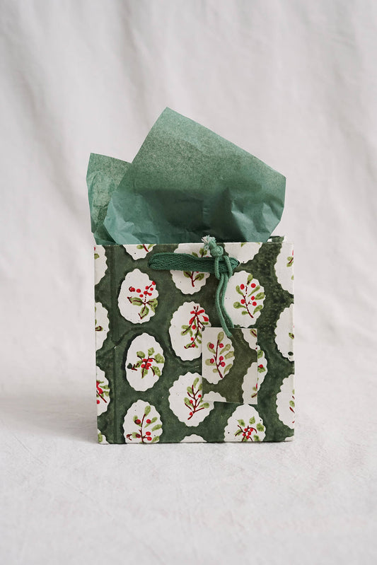green small holiday gift bag with handpainted holly details