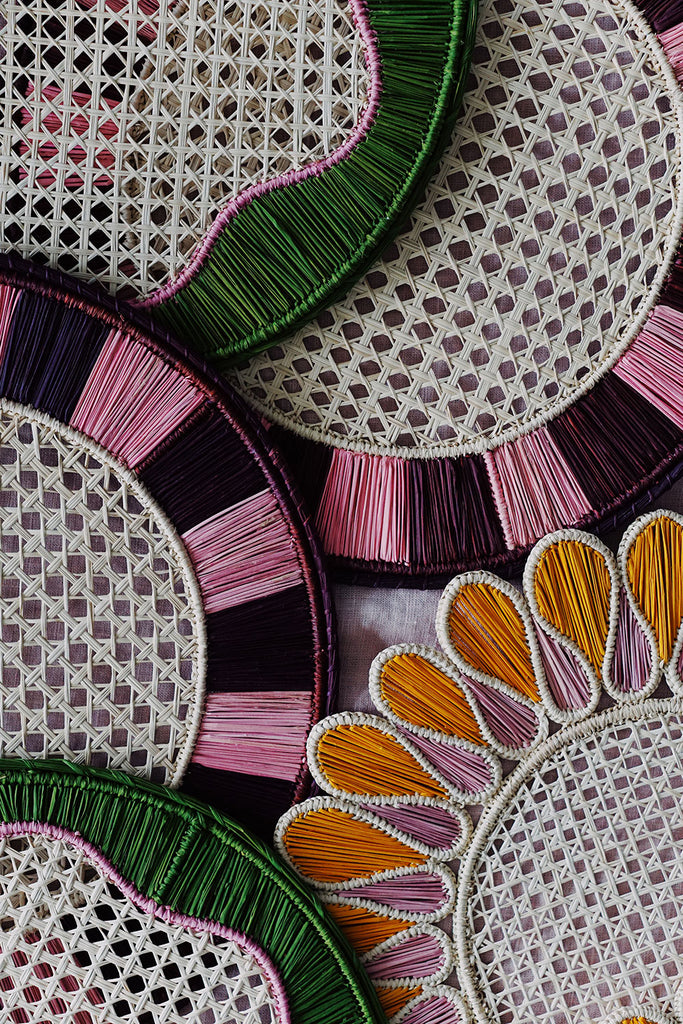 collection of colorful woven boho placemats from studio wallflower