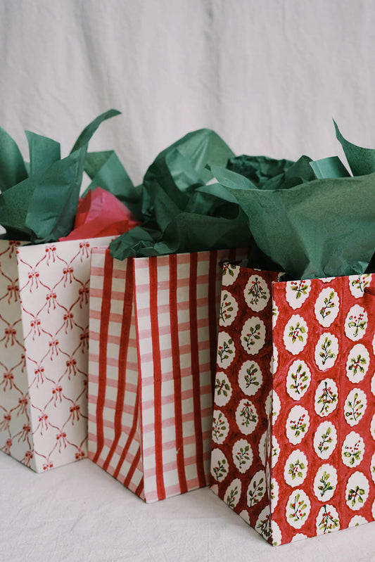 collection of pink and red holiday gift bags - shop eco friendly christmas gift wrapping
