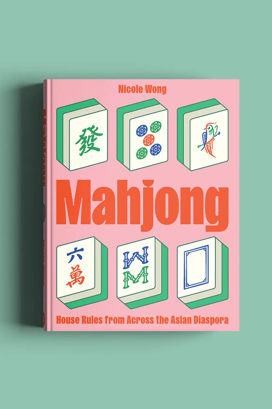 Mahjong book, House Rules from Across the Asian Diaspora' by Nicole Wong on a pink cover 