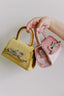 pink and yellow bow bags from meli bags on wallflower