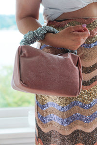 pink velvet top handle clutch bag from meli bags via wallflower