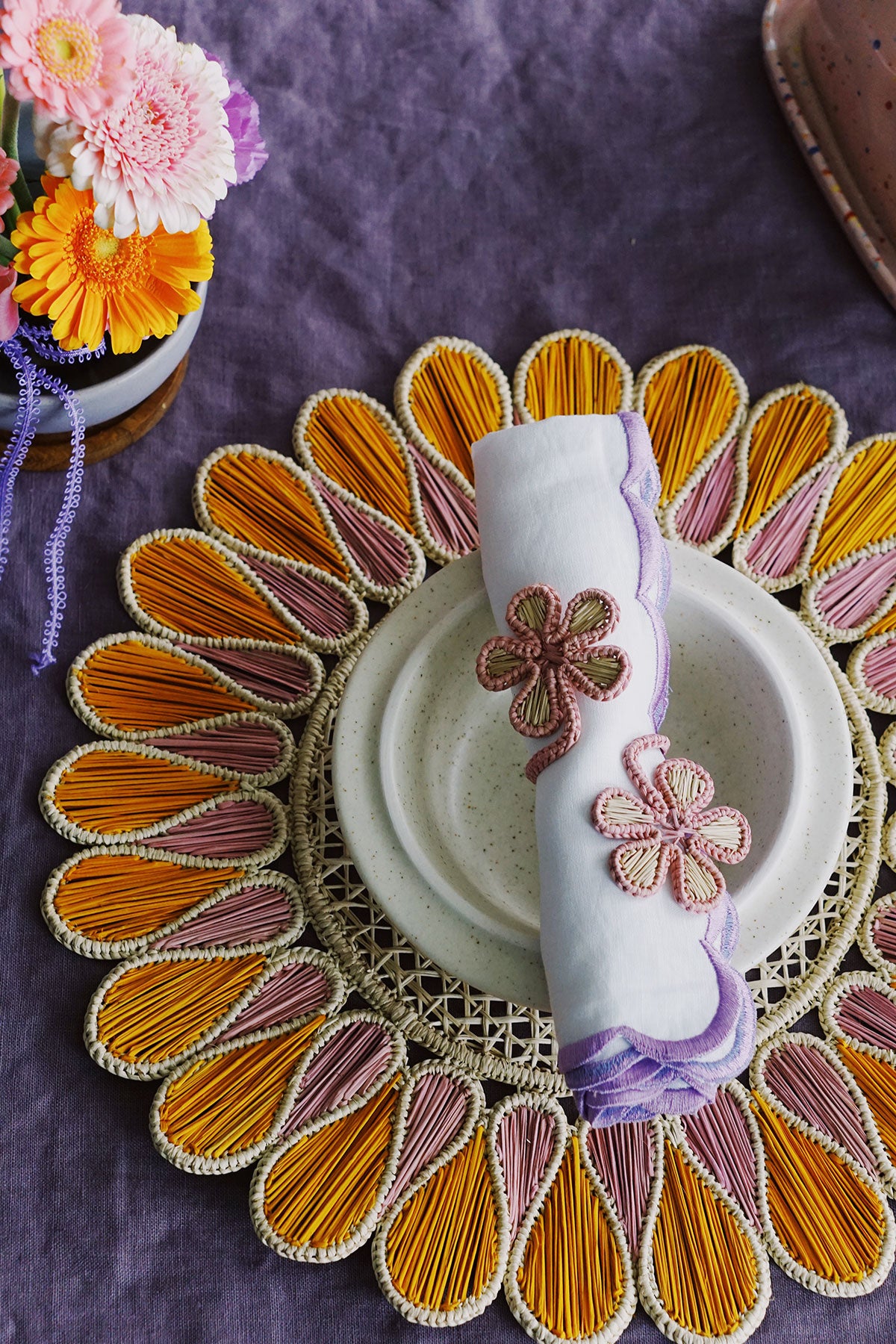 flower marigold and pink cane placemats with floral napkin rings