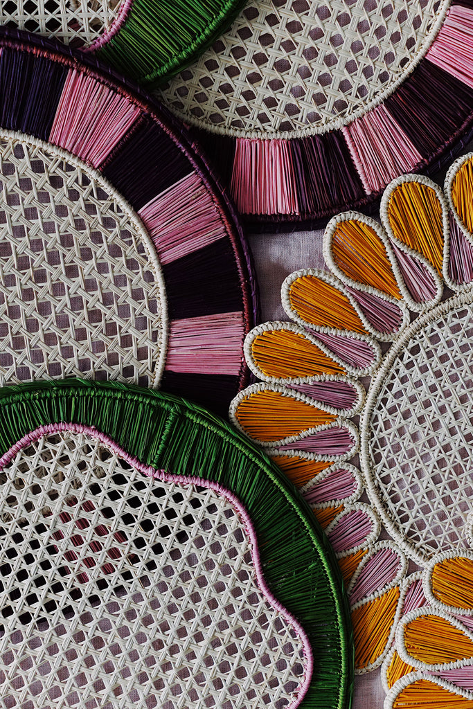 collection of colorful woven placemats available at wallflower
