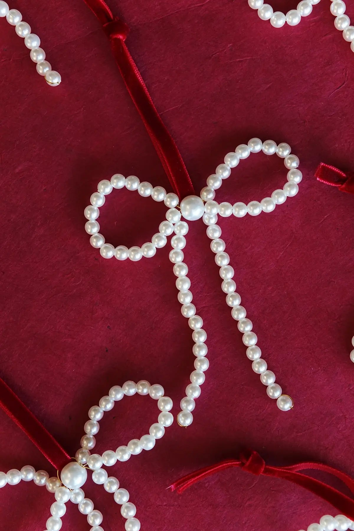 handmade pearl bow ornaments with red velvet ribbon - by wallflower shop