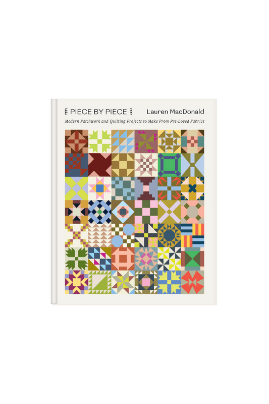 Coffee table book cover of 'Piece by Piece ' with colorful quilt pattern 