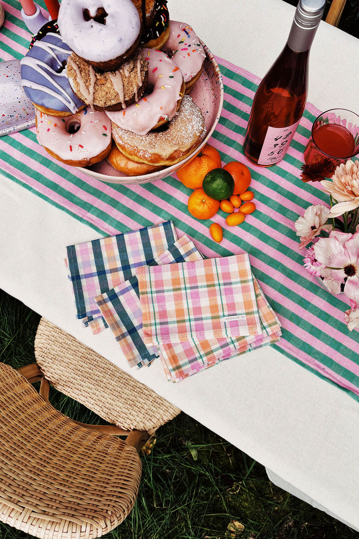summer brunch table with colorful napkins and donuts