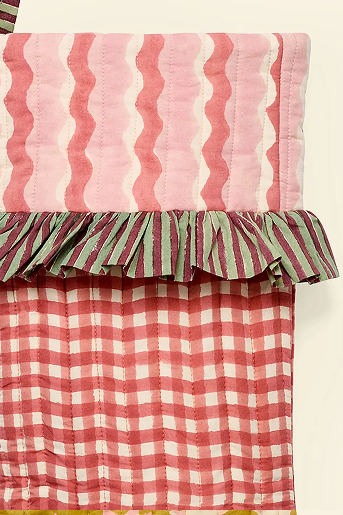 close up of gingham red and pink block printed handmade quilted christmas stockings ✿ shop christmas stockings at wallflower