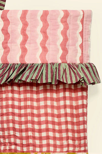 close up of gingham red and pink block printed handmade quilted christmas stockings ✿ shop christmas stockings at wallflower