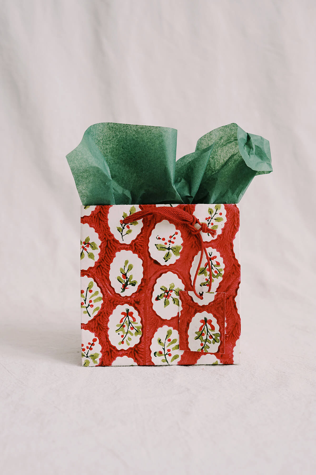 small red christmas gift bags hand painted floral on recycled paper 
