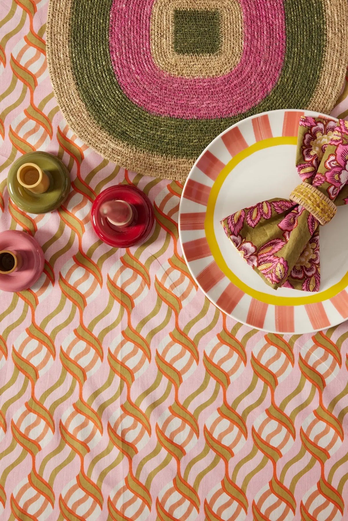 Colorful tablescape with large block print tablecloth in pink, orange, and green - shop handmade cotton tablecloths on wallflower