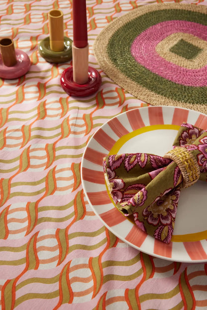 colorful tablescape with large block print tablecloth in pink, orange, and green - shop handmade cotton tablecloths on wallflower