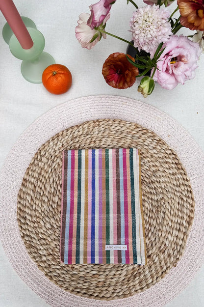 place setting with rainbow cocktail napkin