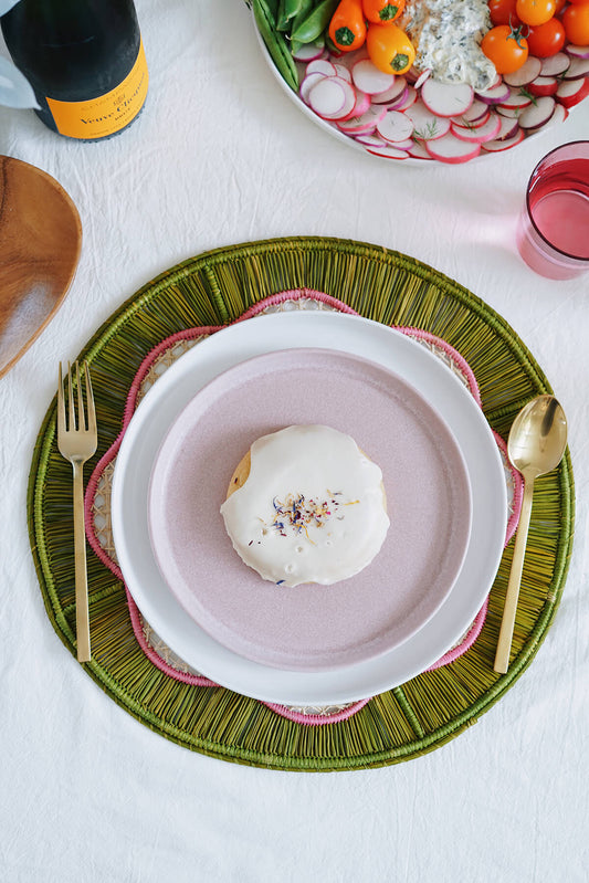 pink + green round woven placemat from wallflower shop - handmade artisan table linens & decor