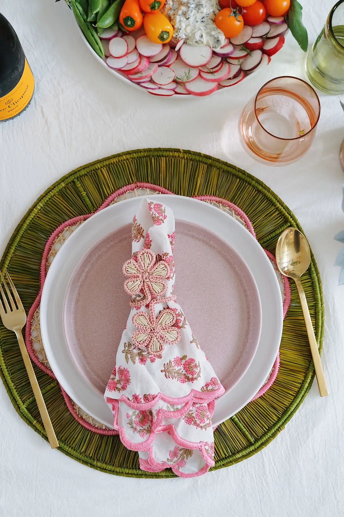 pink + green round woven placemat from wallflower shop - handmade artisan table linens & decor