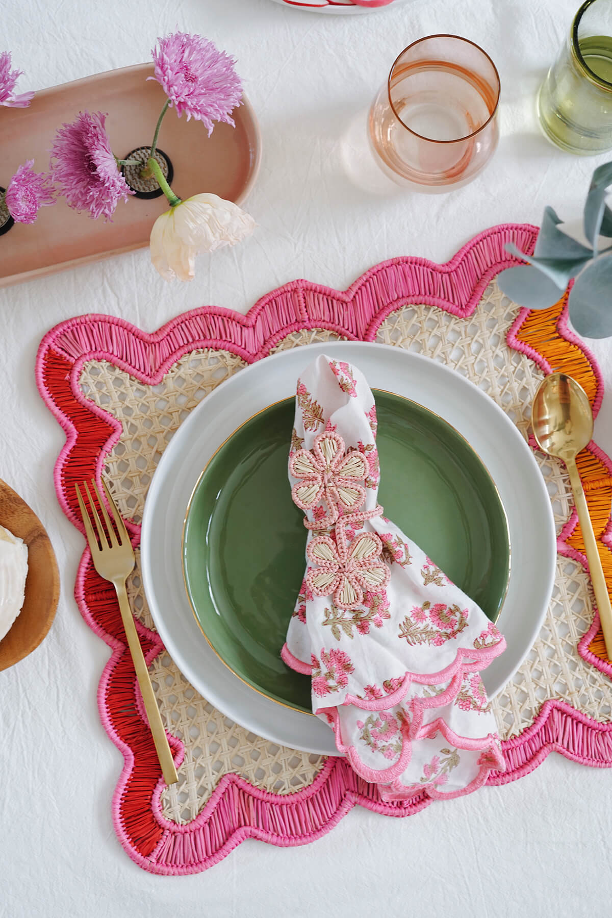 table setting with wavy pink placemats - fair trade woven place mat with pink + orange