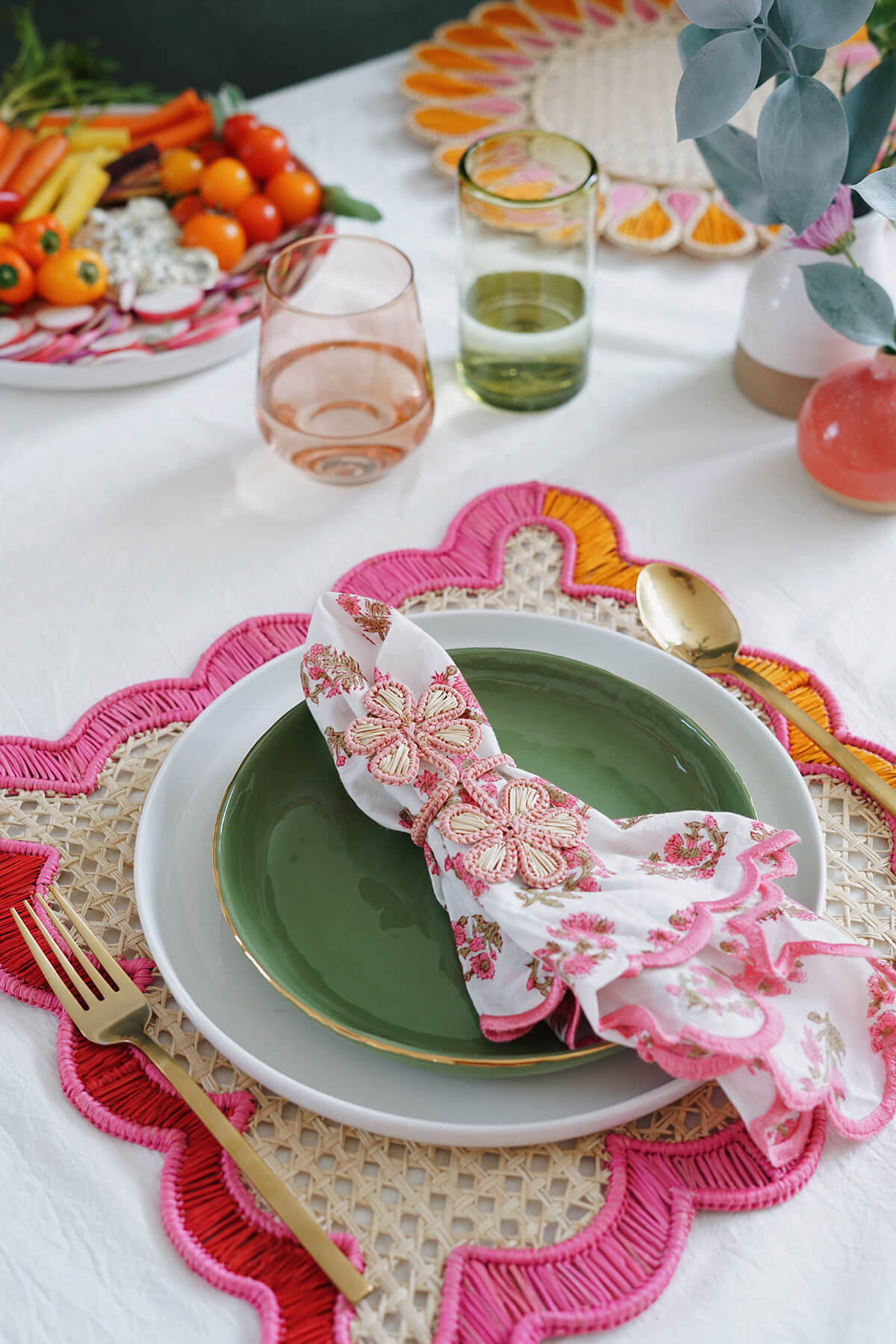 wavy pink placemats - fair trade woven place mat with pink + orange and pink flower napkin rings