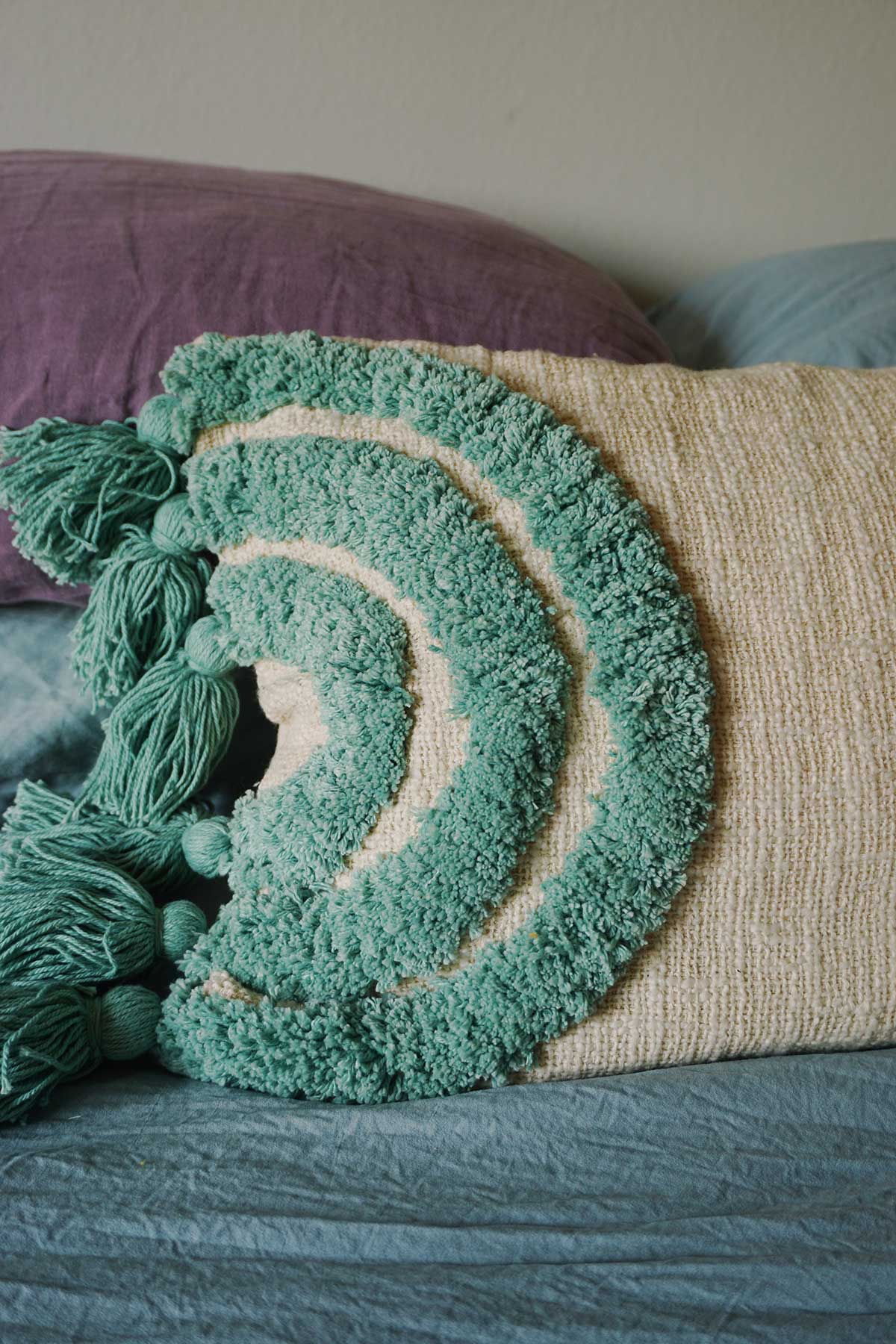 hand tufted throw pillow in rainbow aqua